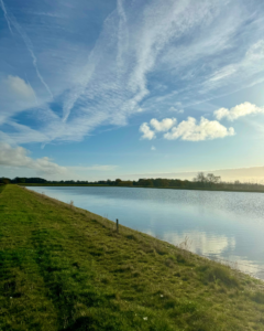 Place UK's reservoir in Norfolk, filled with rainwater on a sunny day.