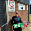 Place UK's Health and Safety Advisor Antoaneta holding signs on site.
